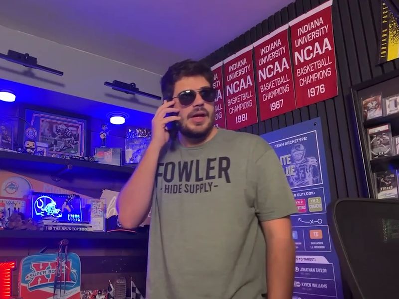 Avery on the phone in his room, wearing sunglasses